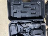 a tool kit that is sitting on the floor next to a pair of shoes