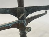 an image of a close up of a metal object on a white surface