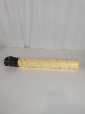 a yellow and black pipe sitting on top of a white table