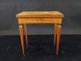 a small wooden table with a drawer on one side and a drawer on the other
