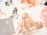 a lot of drawings on the table together