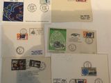 several envelopes with stamps on them sitting on a table