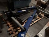 a pile of tools on a pallet in a warehouse