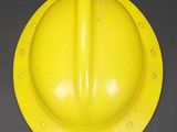 a yellow hard hat sitting on a table
