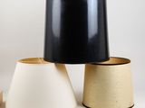 two lamps are sitting next to each other on a white surface