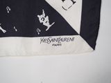 a black and white bandana with a picture of a cat and a dog on it
