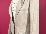 an image of a suit on a mannequin stand