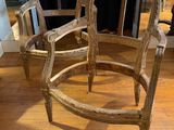 two chairs that are sitting on a wooden floor