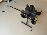 a small camera that is sitting on a tripod on a table