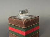 a brown box with a red, green and red stripe on it