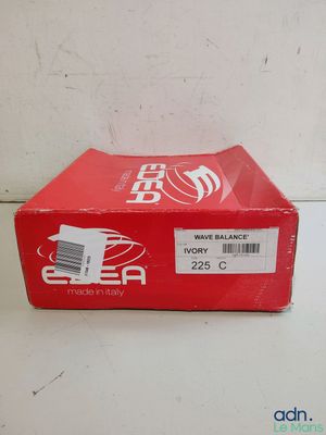 a red box of soda sitting on top of a white table