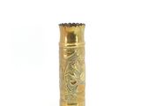 an image of a gold colored metal lighter with a black top
