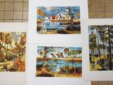 four paintings of trees, a house, and a pond on a tile floor