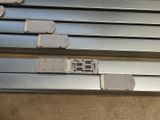 four different types of metal rails on the floor