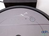 an image of a robotic vacuum cleaner on a table