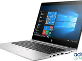 laptop with windows on the screen and windows logo on the screen