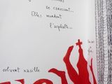 painting on the wall of a bathroom with red paint on it