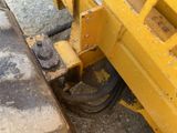 a close up of a machine that is on the ground