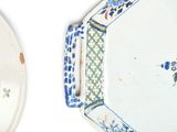 two plates with blue and white designs on them