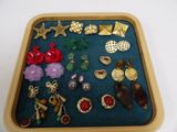 a tray that has a variety of jewelry in it