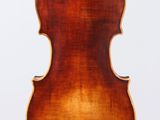 an old violin with a wooden back and a long neck