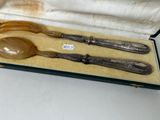 two spoons and a fork in a case