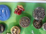 a tray with a variety of buttons on it