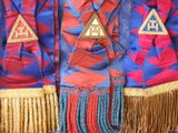 a close up of a colorful jacket with fringes on it