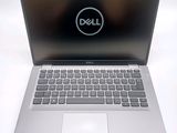 dell laptop computer with dell logo on screen on white surface