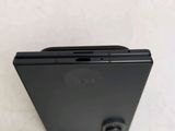 a close up of the back of a cell phone on a white surface