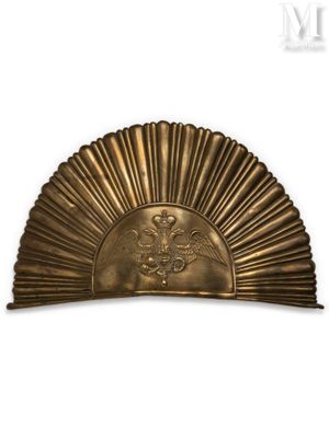 an image of a gold fan with a bird on it