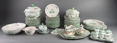 a lot of green and white dishes and plates