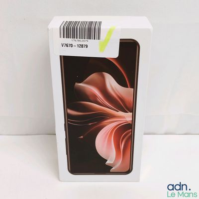 the box is open and the phone is in it ' s packaging