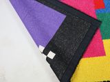 multicolored area rugs on a white background with a black border