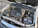 a car with its hood open and the engine in the back