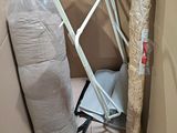 a bag and a chair in the corner of a room