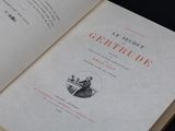 an open book with a picture of a man sitting at a desk