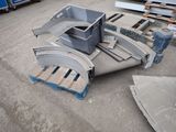 a pile of metal parts sitting on the ground