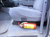 a fire extinguisor in the back seat of a car