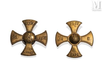 pair of antique iron crosses with a cross on each of them