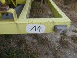 a close up of a yellow trailer with a number on it
