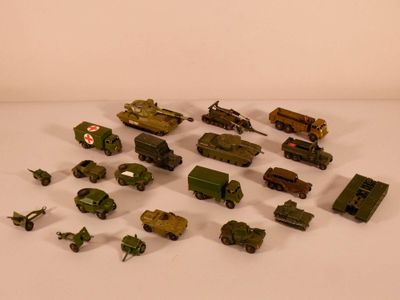 a lot of toy army vehicles on a white surface