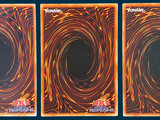three cards with a picture of a black hole in the middle of them
