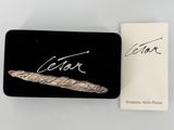an image of a close up of a box with a feather on it