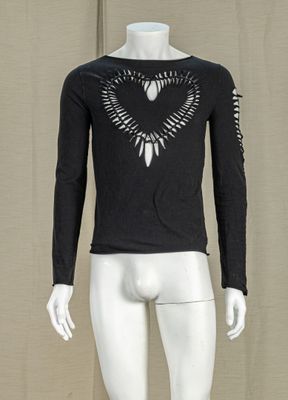 a mannequin wearing a black shirt with a bird design