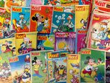 a lot of mickey mouse books on the table