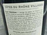a bottle of wine that is sitting on a table