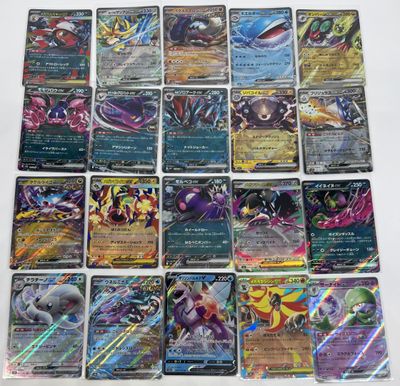 a bunch of pokemon cards sitting on top of a table