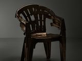 a wooden chair that is sitting in a dark room