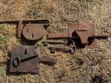 a bunch of old rusty tools that are laying on the ground